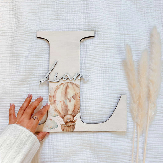 In The Sky Wooden initial